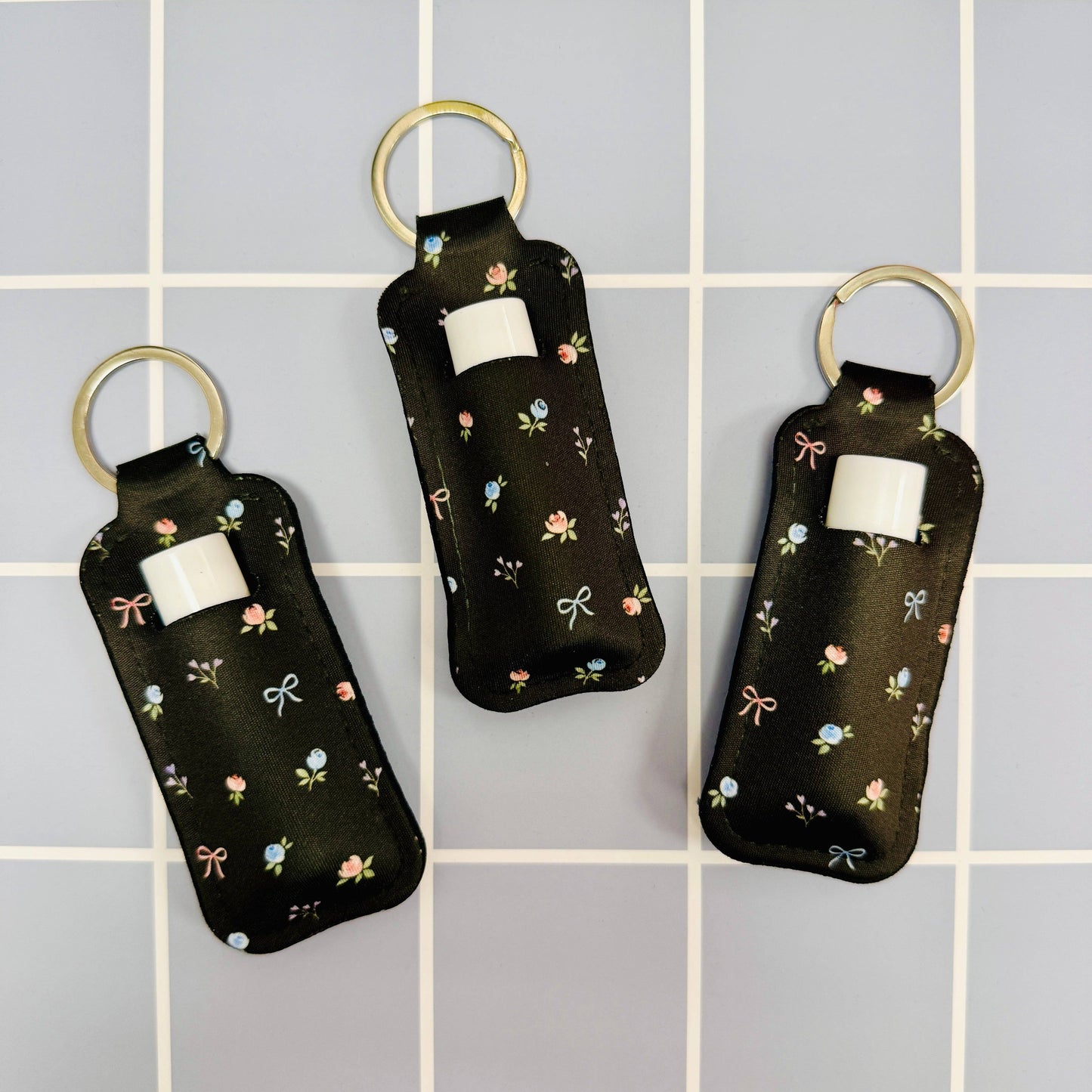 Chapstick Holder Keychain, Black Ditsy Floral and Bows Pattern